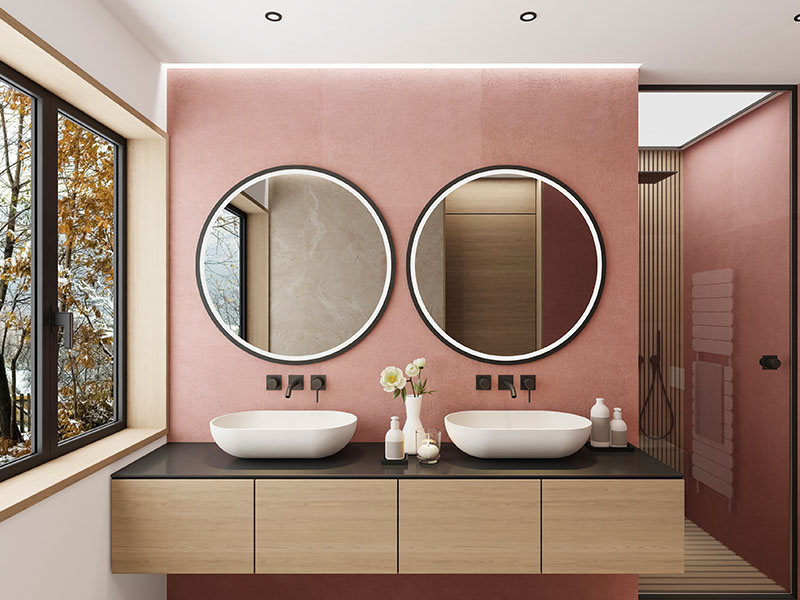Modern bathroom with 2 circular custom mirrors.